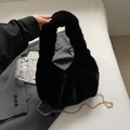 Chic black faux fur handbag with a glossy gold chain strap for autumn winter - Black