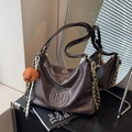 Vintage dark brown faux leather tote with embossed M logo and plush dog charm accessory - With Pendant / Coffee