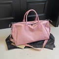 Pink woven large travel bag with handles and nylon shoulder strap in casual style - Pink