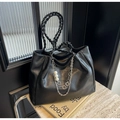 Black tote bag with woven handle, pearl charms, and metallic floral chain details - Black