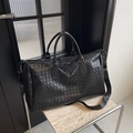 Black woven large capacity travel bag with cross-weave texture and shoulder strap - Black