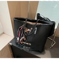 Black canvas tote bag with dog embroidery and colorful charm accessories - Black with Pendant