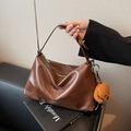 Brown vintage leather tote bag with soft texture and cute plush puppy charm - Brown PU Leather