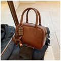 Brown vintage Boston bag with leather sheen featuring horse and chocolate charms - Brown with Pendant