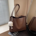 Brown litchi grain leather tote bag with white plush cloud pendant and slim straps - Coffee