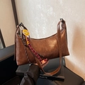 Retro caramel crescent underarm bag with smiley charm and adjustable strap - Brown