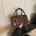 Dark brown faux leather crossbody bag with woven tassel and top handle details - Coffee with Pendant