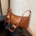Retro caramel brown underarm bag in matte faux leather with a yellow smiley pendant - Brown