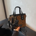 Brown leopard print bucket bag with black leather trim and a cute puppy charm - Black and Brown with Pendant
