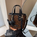 Brown leopard print mini bucket bag with black handles and dog charm accessory - Black And Coffee With Pendant