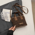 Mini leopard print bucket bag with brown leather handles and adjustable shoulder strap - Black Coffee (Without Charm)