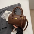 Deep brown cylindrical Boston bag with gold metallic detail and leather texture - No Pendant / Brown