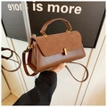 Brown color-block handbag with leather and suede mix, featuring gold metal lock and strap - Brown