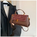 Retro brown leather and burgundy suede handbag with gold clasp in handheld view - Coffee Red