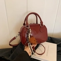Retro burgundy leather handbag with dog plush charm and adjustable shoulder strap - With Pendant / Burgundy