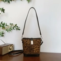 Retro leopard print bucket bag with black leather trim and silver metal buckle - Small / Leopard Print