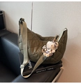 Detail of olive green quilted crescent bag with a decorative leopard print cartoon charm - Green (with Pendant)