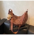 Deep brown quilted crescent crossbody bag with adjustable strap and plush charm accent - Coffee (With Pendant)