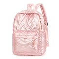 Close-up of pink quilted backpack with metallic sheen, zipper pocket and strap detail - Pink