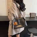 Black PU leather shoulder bag with metal chain strap and brown teddy bear charm - Black with Pendant