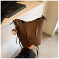 Brown litchi grain leather bucket bag with baseball charm and fashion logo imprint - With Charm / Brown
