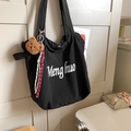 Minimalist black tote bag with cute brown plush bear charm and woven rope detail - Black with Pendant