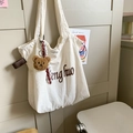Cream canvas tote bag with teddy bear charm and striped scarf for daily commute - White with Pendant