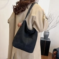 Stylish black large capacity underarm bucket bag for women featuring a cute brown charm - Black with Pendant