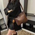 Retro dark brown leather bucket shoulder bag with a cute yellow bear pendant - With Charm / Brown
