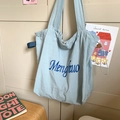 Light blue fabric tote bag with dark blue lettering print and long handles - Blue Without Charm