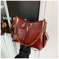 Vintage burgundy leather tote bag featuring gold chain strap and side pocket detail - With Charm / Burgundy