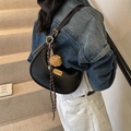Classic black leather hobo bag with gold hardware and woven pendant detail - With Charm / Black