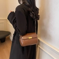 Retro brown leather crossbody pillow bag with gold clasp and adjustable strap - Brown