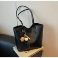 Close-up of black PU leather tote bag featuring a wave-edge design and baseball charm - With Charm / Black