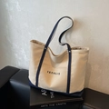 Large beige canvas tote bag with contrast navy straps and front pocket detail - Khaki