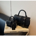 Detailed shot of two black vintage crossbody bags with mixed leather texture and golden chains - Black Large