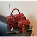 Detail of burgundy patchwork leather handbags with chain strap on a fashion magazine - Red Large