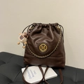 Deep brown bucket backpack with gold chain detail and plush lamb charm for women - With Charm / Brown