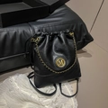 Black leather drawstring backpack featuring a gold M logo and chic chain strap - No Pendant / Black