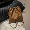 Caramel brown drawstring bucket backpack with gold M logo and metallic chain details - No Pendant / Brown