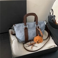 Denim blue crossbody bag with brown leather handles and a teddy bear charm - Blue with Charm