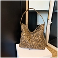 Detailed view of the vintage leopard print tote bag with wide shoulder strap on a display - Leopard Brown