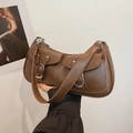 Deep brown leather shoulder bag featuring dual front pockets and silver buckle accents - Brown