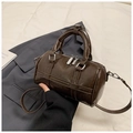 Deep brown glossy Boston bag with dual handles and silver hardware on a blazer - Coffee without Pendant