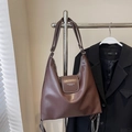Brown matte leather hobo bag featuring a decorative silver chain and long shoulder strap - Coffee No Charm