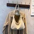 Minimalist beige hobo tote bag in soft leather with wide strap for daily commute - No Pendant / Off White