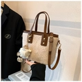 Detail of beige fleece bucket bag with brown leather handle and cute plush charm - Beige (With Pendant)