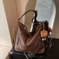 Retro large-capacity dark brown tote bag with fuzzy monster charm and zipper detail - Brown