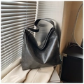 Detail of vintage grey leather tote bag with wide shoulder strap and woven tag - Black