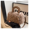 Detail of curly sherpa fleece texture and smooth faux leather handle on khaki crossbody bag - Brown